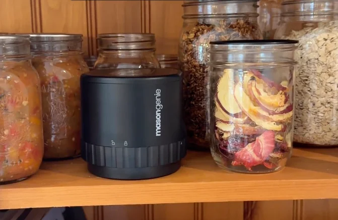 The Mason Genie sealing a jar of coffee beans
